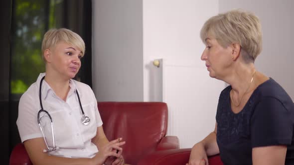 The Woman Doctor is Telling How to Treat the Disease to Elderly Patient