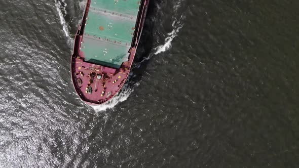 Cargo vessel sailing on a dutch river