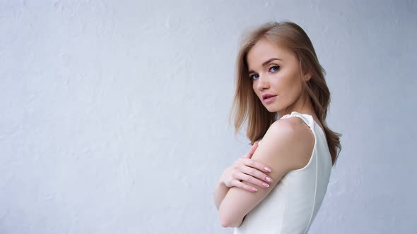 Portrait of Gorgeous Blonde Lady with Healthy Hair Isolated on White