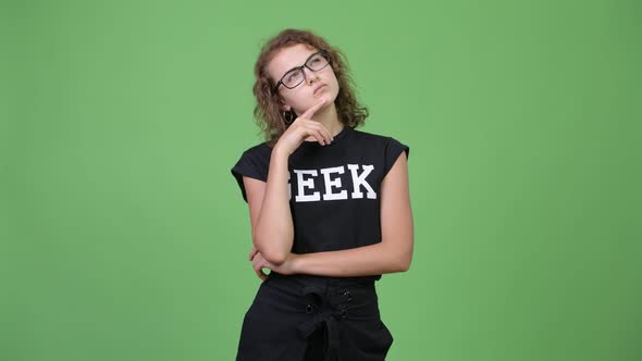 Young Beautiful Nerd Woman Thinking While Looking Up