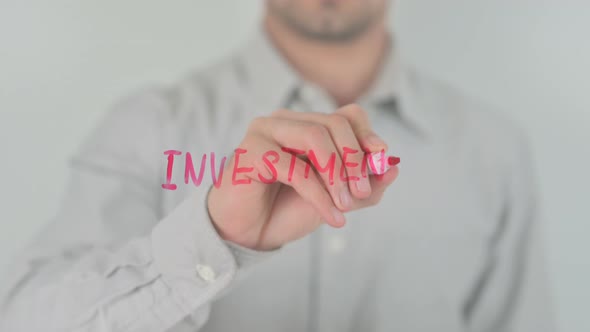 Investment Writing on Screen with Hand