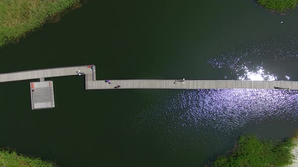 Aerial view of the long wooden promenade on a beach of Yantarny resort town, Russia