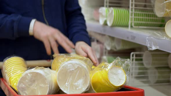 Closeup of Disposable Cups Stacked in a Shopping Cart for a Party or Birthday