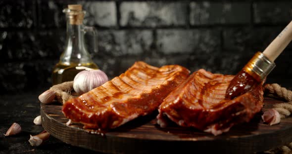 Raw Ribs Smeared with Sauce on a Wooden Tray. 