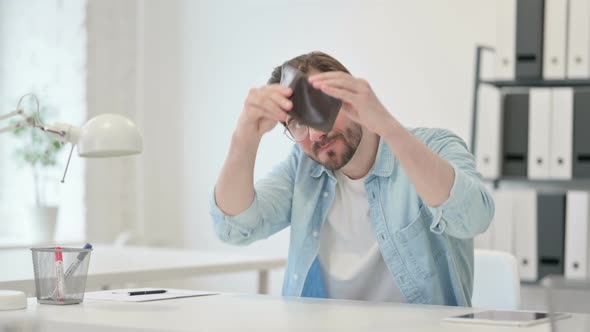 Young Man Checking Empty Wallet Work