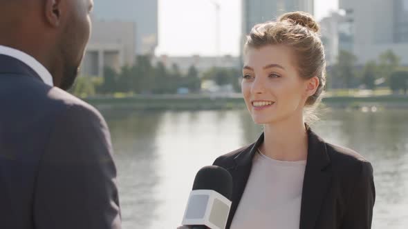 Woman Giving Interview Outdoors