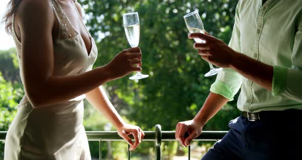 Romantic couple toasting champagne glasses