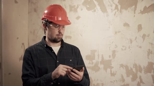 Professional Handsome Man with a Phone Indoor