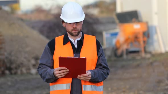 Portrait of serious architect at construction site