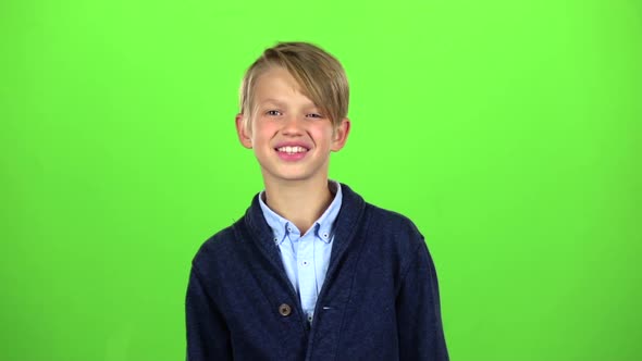 Baby Boy Shows Thumbs Up. Green Screen. Slow Motion