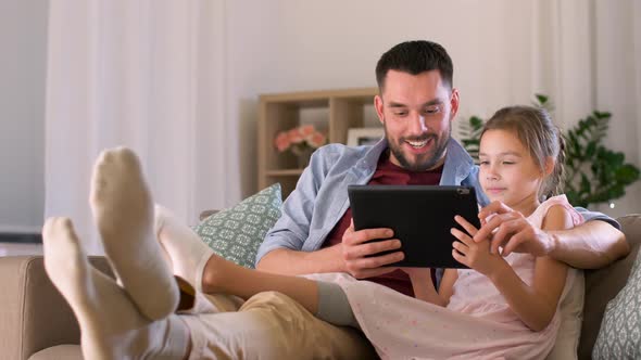 Father and Daughter with Tablet Pc at Home 14