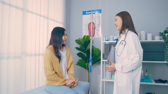 Asian woman patient visit and consult health problem with young doctor.