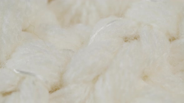 White Knitted Cloth Light Woolen Clothes Fabric Closeup Woven Textile Background