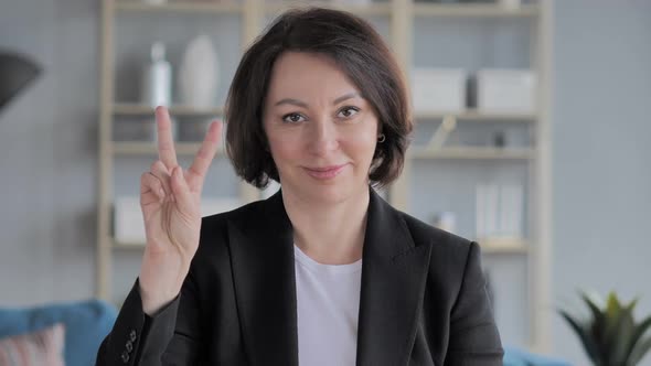 Portrait of Old Businesswoman Gesturing Okay Sign