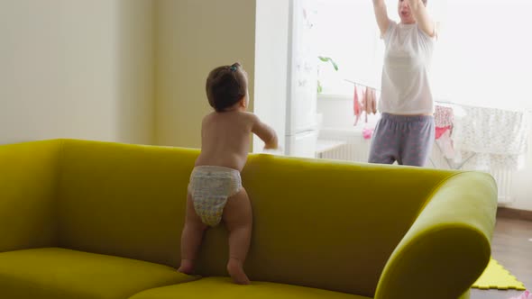 Playful Mother and Baby are Having Fun Dancing