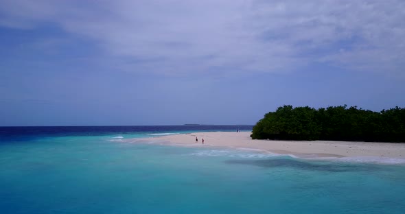 Luxury birds eye abstract view of a summer white paradise sand beach and blue sea background in colo