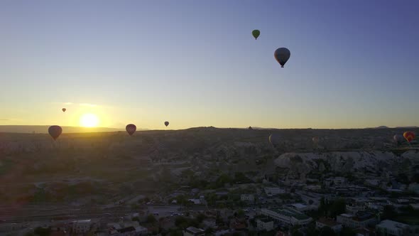 Colorful Hot Air Balloons Flying Over the Valleys