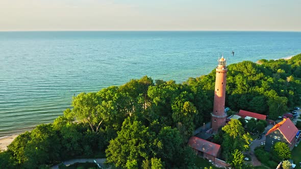 Aerial view of lighthouse on sunrise by Baltic Sea, Poland
