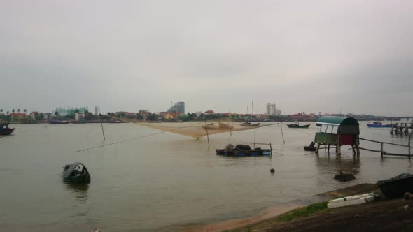 Vietnam fishing boats in a river, tripod shot