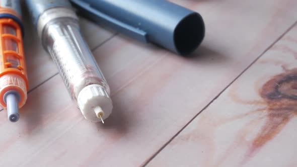 Many Insulin Pens on Table Background Close Up