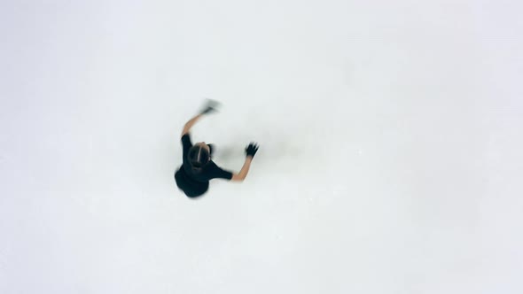 Top View of an Ice Rink with a Young Female Skater