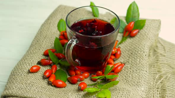 Natural Tea Made From Red Rosehip Berries, Homeopathy Herbal Tincture Of Berries. Fruit Red Tea.