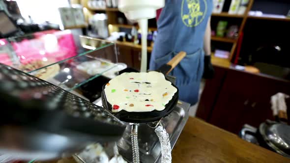 Pouring Dough on Waffle Maker