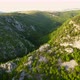 Aerial view of karst landscape, with valleys and cliffs, at sunset - VideoHive Item for Sale