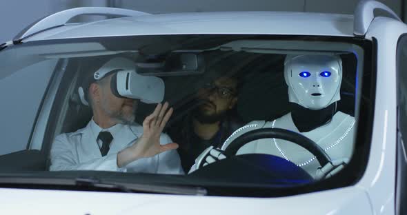 Scientists Testing a Car Driving Robot