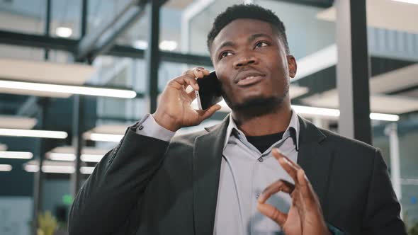 Multinational Male Confident Businessman Investor Man Making Call Business Partner on Mobile Phone