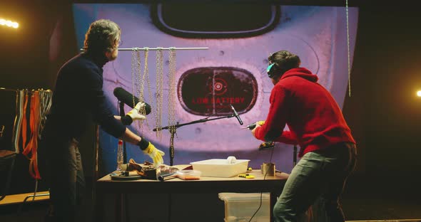 Men Creating Metallic Sounds for 3D Cartoon