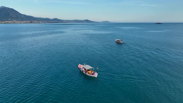 Sunrise Fishing boat goeas to sea aerial view Turkey Alanya 4 K