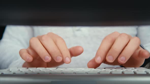 Male Hands Type on Desktop Keyboard at Home