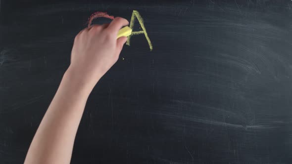 Term Gay Pride is Drawn By Hand Colored Chalks on a Chalkboard Timelapse alt