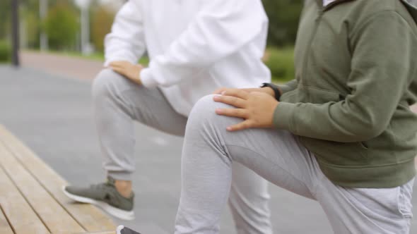 Asian Boy and His Mother Doing Stretching Exercise Outdoors