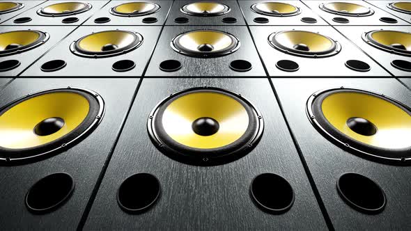 Static View of Audio Speakers with Yellow Membrane Stacked in Rows Playing Music