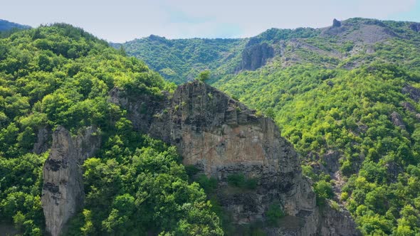 Drone Flight Over Steep Hill Towards The Summer Mountains