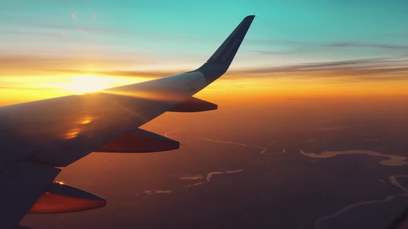 Beautiful Sunset With Scenic Landscape From Airplane Window