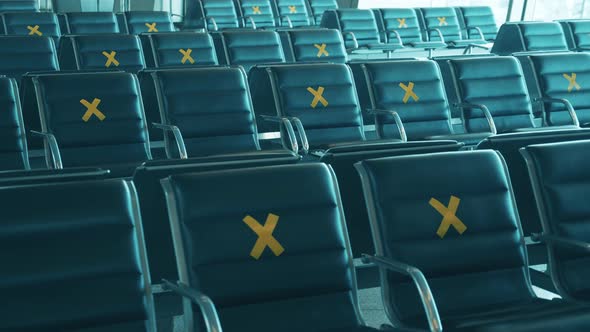 Airport Seats Marked with Crosses for Social Distancing