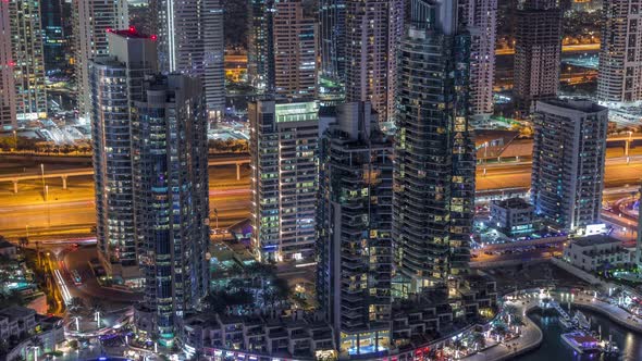 Dubai Marina Skyscrapers and Jumeirah Lake Towers View From the Top Aerial Night Timelapse in the