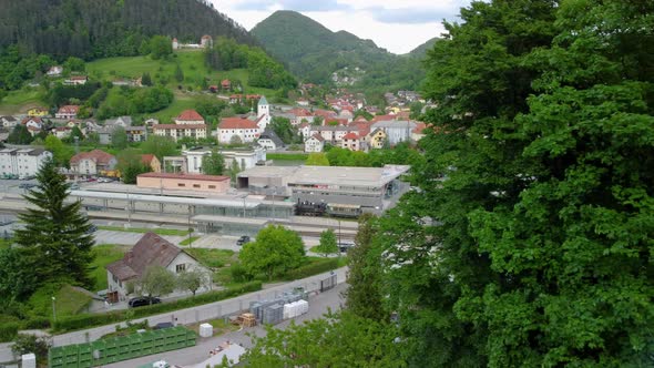 City Laško in Slovenia with small castle and big beer brewery. Aerial 4k Drone view.