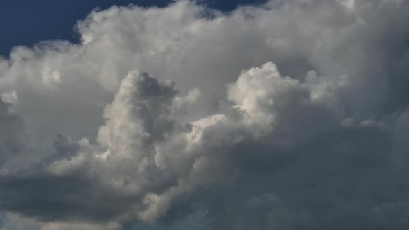 Time lapse of dramatic rain clouds, weather change. alt