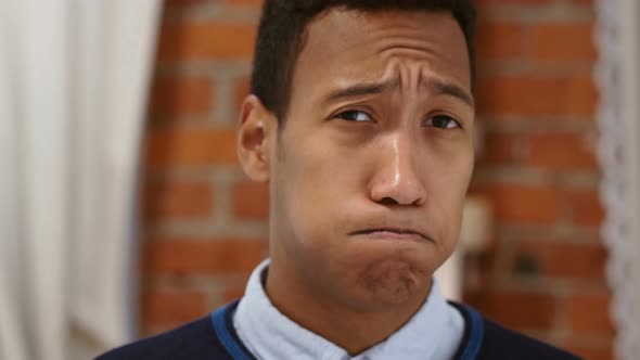 Portrait of Shocked Young African Man, Amazed by Surprise