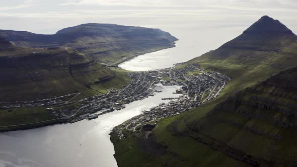 Drone Toward Klaksvik Town Below With Klakkur Mountain