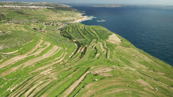 AERIAL: Revealing Ta Cenc Cliffs and Comino Island in Blue Mediterranean Sea