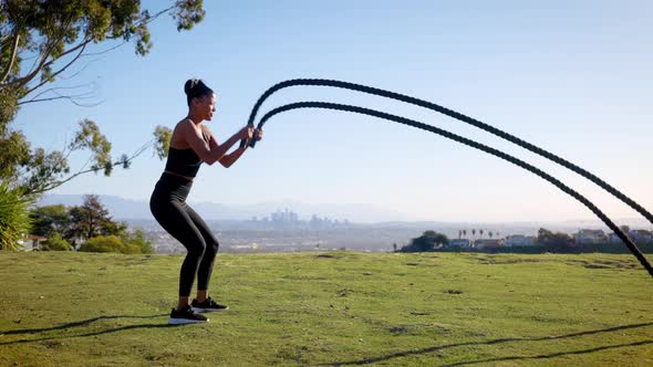 Mixed ethnicity woman Exercising in a park in Los Angeles