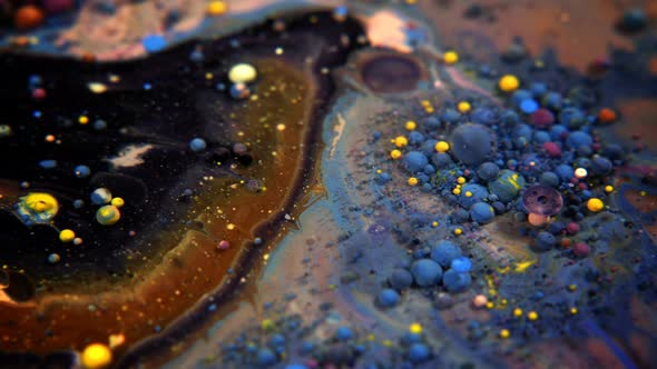 Abstract Colorful Acrylic And Food Paint Bubbles On Water 