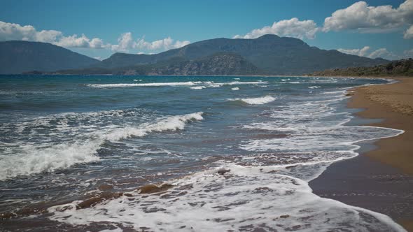 Slow Motion Waving Sea with Waves at Sunny Summer Windy Day at Beautiful Sandy Empty Beach Iztuzu in