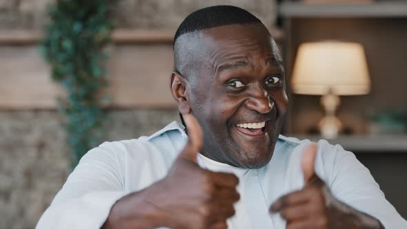 Elderly African American Excited Senior Man Happy Winner Grandpa Showing Two Thumbs Up Positive Hand