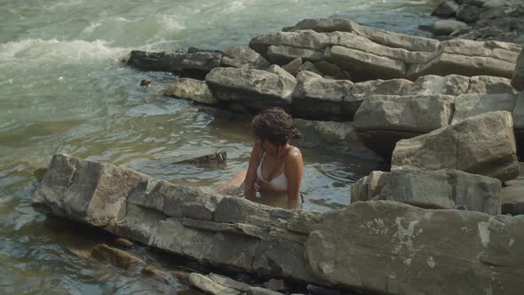 Elegant Lovely African American Woman in Swimsuit Sunbathing on Mountain River